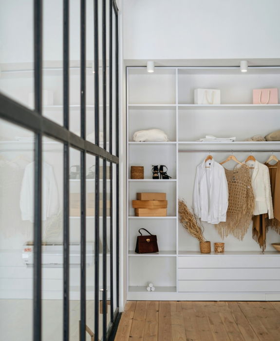 white bath towel on white wooden cabinet